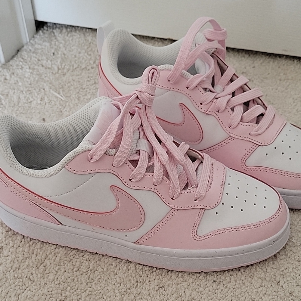 Nike Pink and White Sneakers with Classic Design and Large Swoosh